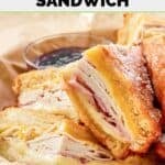 Homemade Cheddar's monte cristo sandwich in a parchment paper lined serving basket.