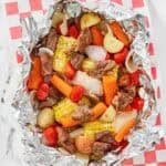 Copycat Cracker Barrel campfire beef meal in foil on parchment paper.