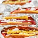 Homemade Five Guys hot dogs in foil.