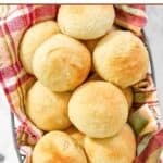 Homemade golden corral yeast dinner rolls piled in a serving basket.
