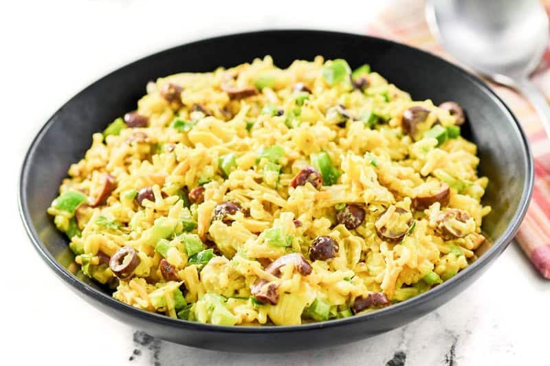 Rice-A-Roni artichoke rice salad with curry in a serving bowl.