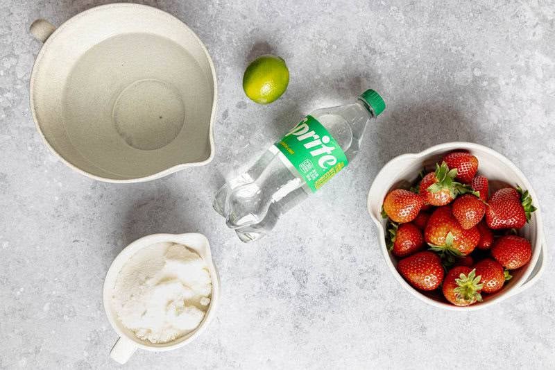 Copycat Sonic strawberry limeade ingredients on a marble surface.