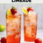 Two glasses of homemade Sonic strawberry limeade, strawberries, and lime wedge.