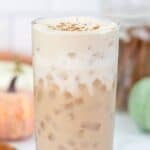 Homemade Starbucks iced pumpkin cream chai latte in a tall glass.
