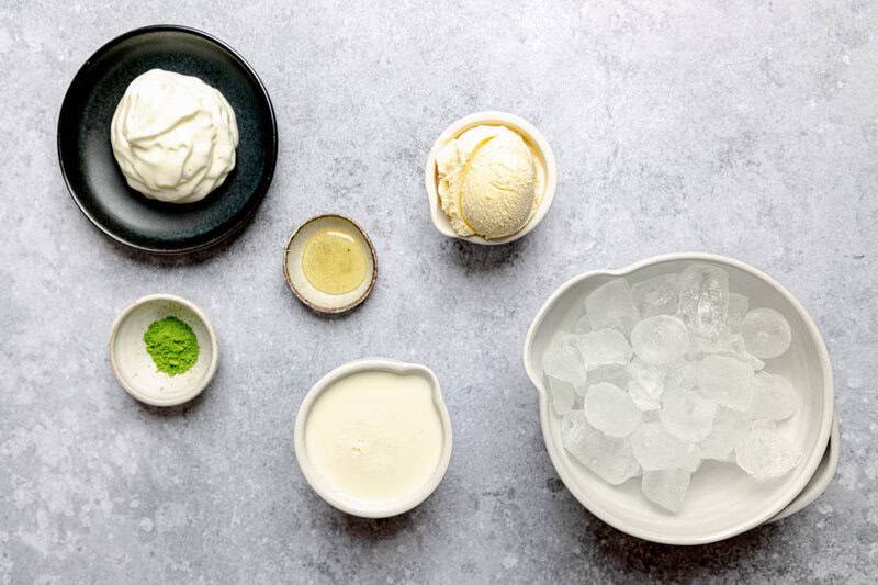 Copycat Starbucks matcha green tea frappuccino ingredients on a marble surface.