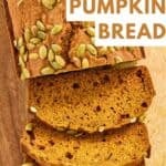 A loaf of homemade Starbucks pumpkin bread partially sliced.