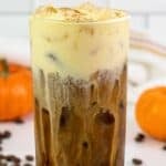 A glass of copycat Starbucks pumpkin cream cold brew coffee drink.