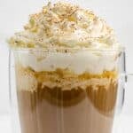 Copycat Starbucks pumpkin spice latte drink on a coaster.
