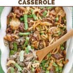 Hamburger green bean casserole in a ceramic baking dish.