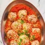 Copycat Olive Garden meatballs and sauce in a skillet.