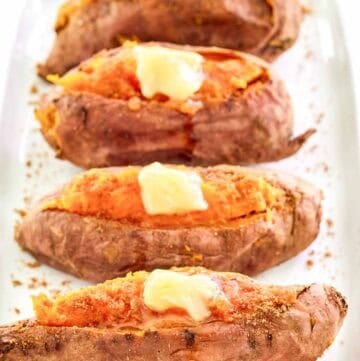 Copycat Outback Steakhouse baked sweet potatoes with honey butter and brown sugar.