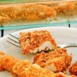 Ritz cracker chicken tenders and a fork on a plate.