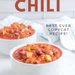 Two bowls of copycat Wendy's chili on a marble surface.